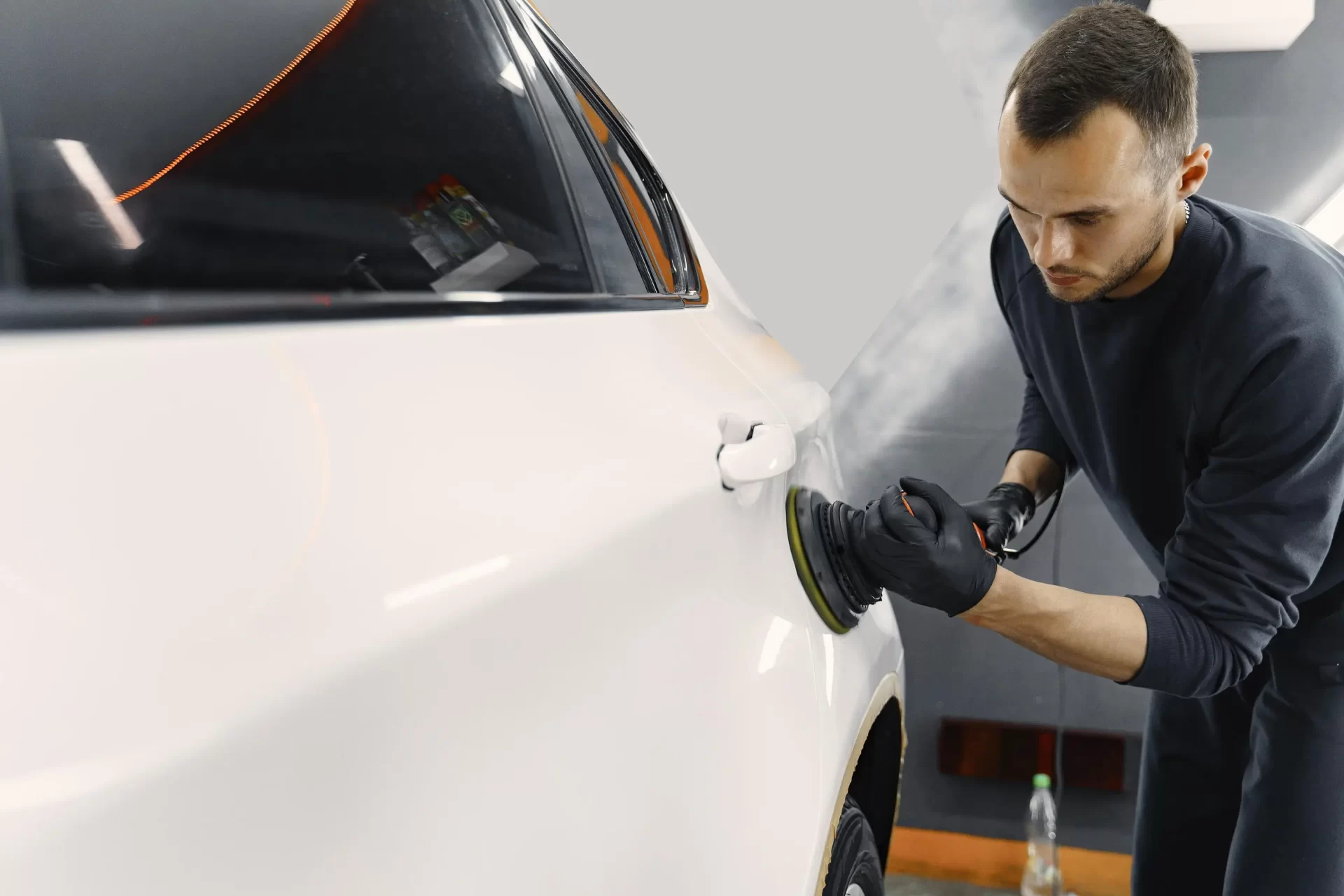 man-polish-car-garage_web.webp